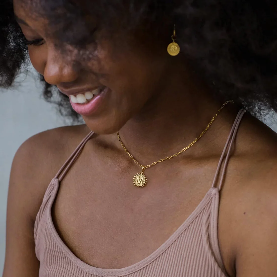 Yoosteel layered initial necklace worn at the collarbone